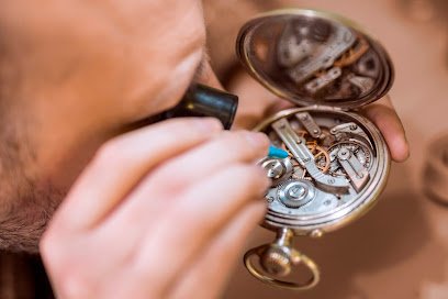 Close up portrait of a watchmaker at work.