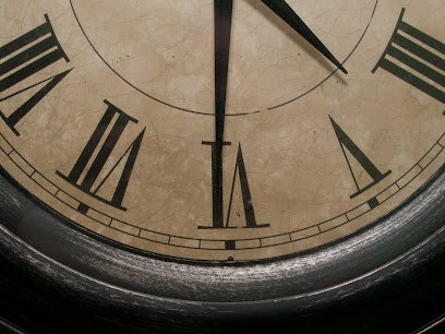 Imitation antique clock hanging on the wall in my kitchen